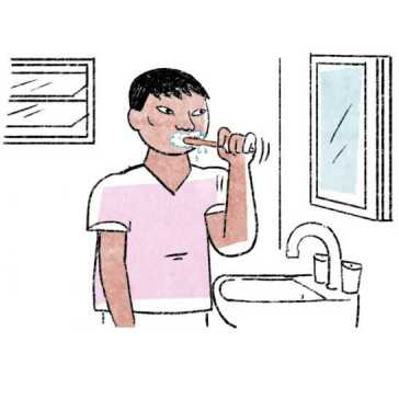 A man brushing his teeth.