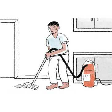 A man vacuuming the floor.