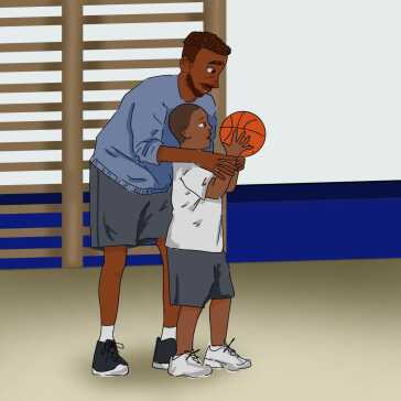 A man showing a boy how to play basketball.